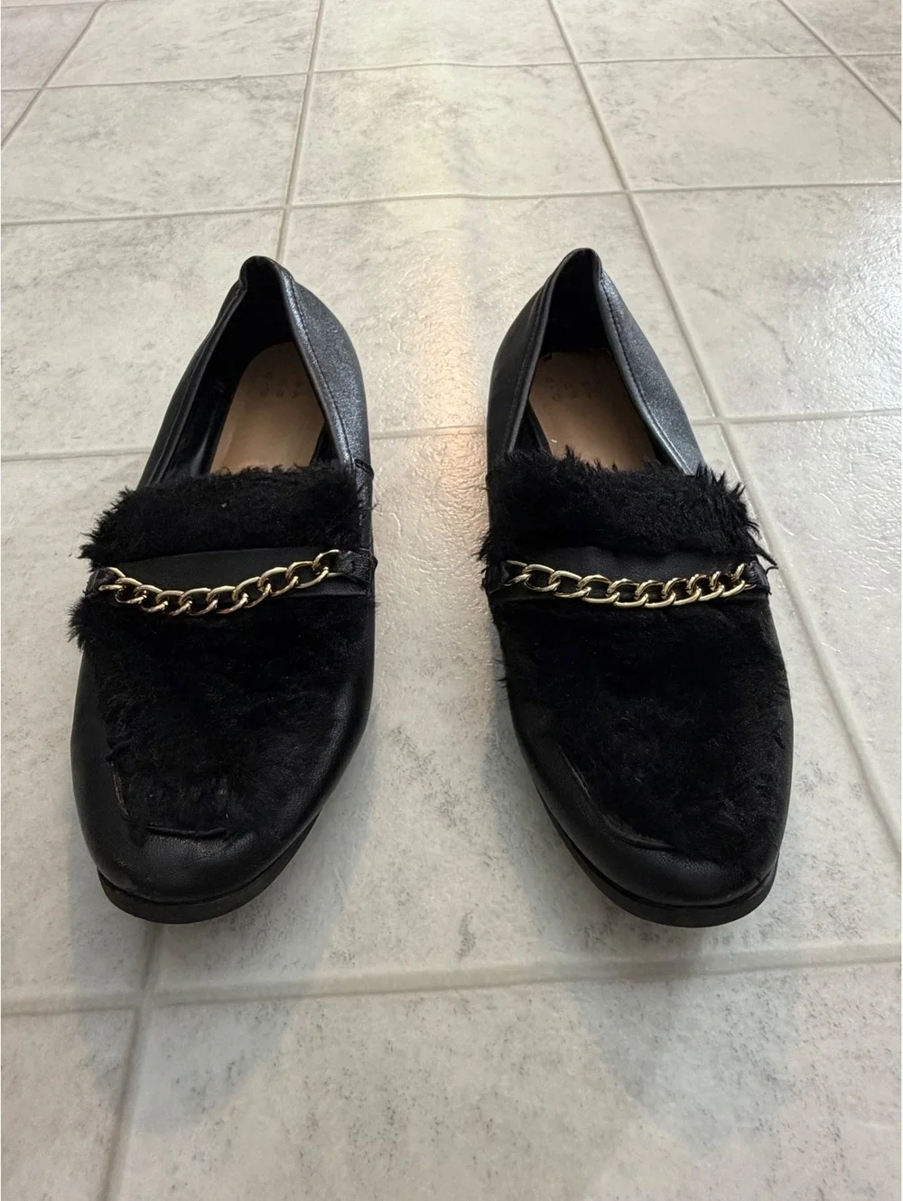 Black loafers with chain detail